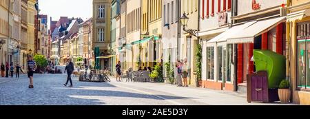 Collegienstrasse Altstadt cobblestone street with heritage buildings shops restaurants and cafes in Lutherstadt Wittenberg Saxony-Anhalt Germany. Stock Photo