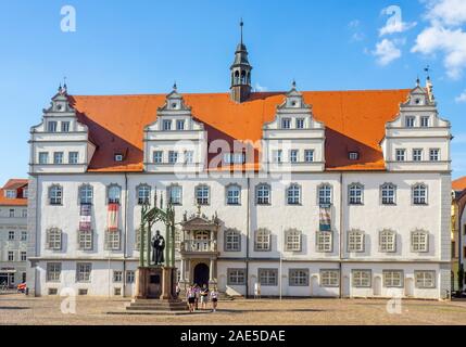 Lutherdenkmal bronze statue of Martin Luther in Marktplatz in front of Rathaus Lutherstadt WittenbergSaxony-Anhalt Germany. Stock Photo