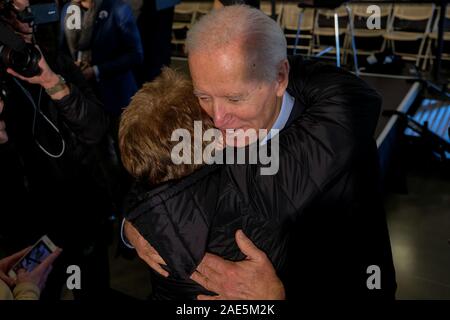 Cedar Rapids, United States. 06th Dec, 2019. Presidential candidate, former Vice President Joe Biden embraces his supporter during his “No Malarkey” bus tour in Cedar Rapids. Credit: SOPA Images Limited/Alamy Live News Stock Photo