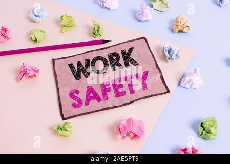Handwriting text writing Work Safety. Conceptual photo policies and procedures in place to ensure safety in workplace Colored crumpled papers empty re Stock Photo