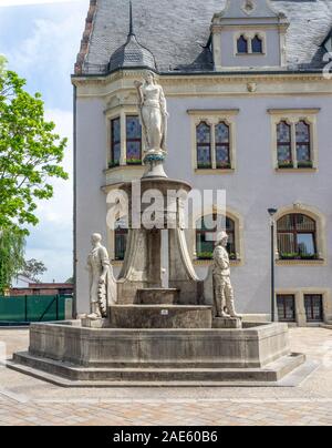 Stone statues and fountain in front of Neo-Renaissance Rathaus town hall of Schönebeck Saxony-Anhalt Germany Stock Photo