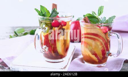 Apple cider cocktail with cranberries cinnamon, cardamom and anise Stock Photo