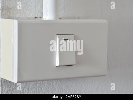 toggle switch in plastic box on the wall Stock Photo