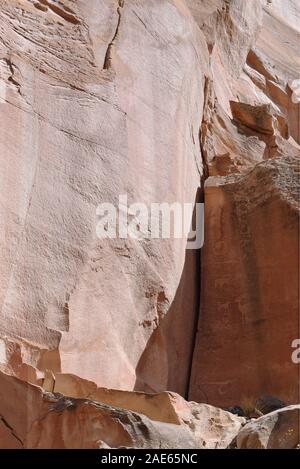 Petroglyphs carved into the cliff face along Utah State Route 24 that runs through Capitol Reef National Park. Stock Photo