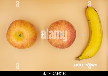 Two apples added together equal a banana,concept image of Fake News. Stock Photo