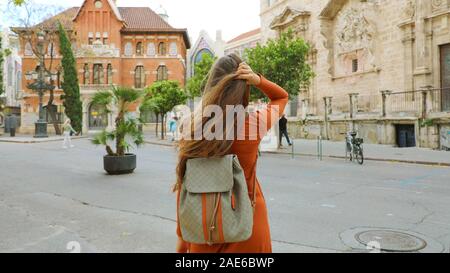 Travels in Europe. Young female backpacker visits the city of Valencia, Spain. Stock Photo