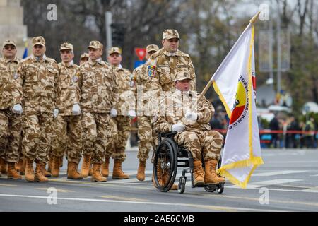 Bucharest, Romania - December 03, 2019: Romanian army veteran soldiers, injured and disabled (one sitting in a wheelchair dressed in his military dese Stock Photo