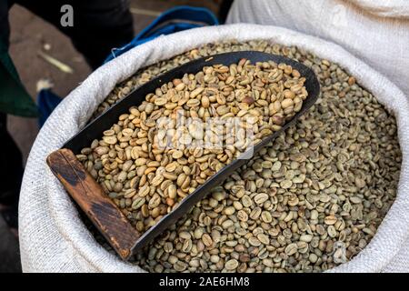 Ethiopia, Amhara Region, Gondar, Arada Market, scoop in sack of sack of raw high grade coffee beans Stock Photo