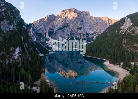 Aerial view of the beautiful reflection of Seekofel mountain in Lake Braies at sunrise, Italy Stock Photo