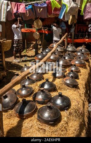 Eth553Ethiopia, Amhara Region, Gondar, Arada Market, ceramic cooking pots displayed on straw Stock Photo