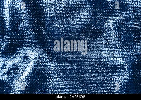 Abstract textured glowing holographic background in classic blue color. Stock Photo