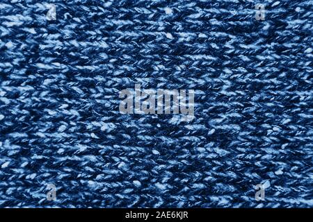 Knitted woolen texture background in trendy classic blue color. Stock Photo