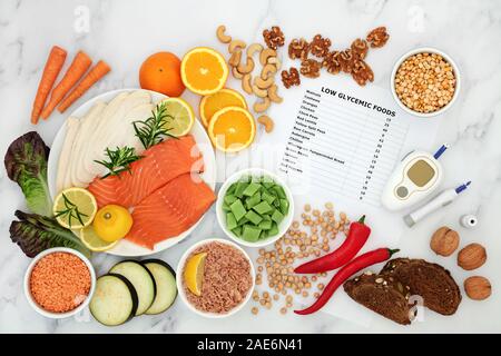 Low glycemic food for diabetics with blood sugar testing device & lance. Foods below 50 on the GI index as per list . Stock Photo