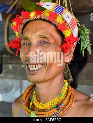 Muara Siberut, Mentawai Islands, Indonesia, 3 NOVEMBER 2019: Portrait  tribal men - shaman, with traditional tattoos, at his rainforest home Uma, duri Stock Photo