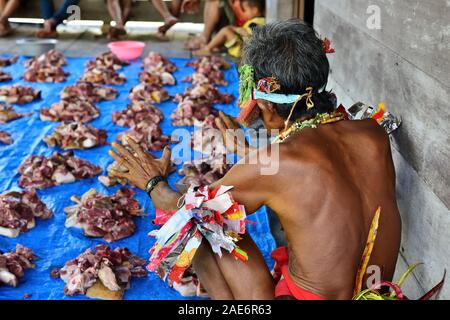 Portrait  tribal men - shaman, with traditional tattoos, at his rainforest home Uma, during the traditional ceremony for the protection of the clan Stock Photo