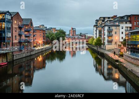 Apartments and other waterfront buildings along the River Aire, Leeds, West Yorkshire, England, UK Stock Photo