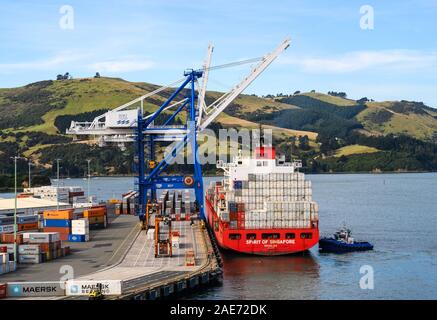 Container ship, Spirit of Singapore, berthed at Port Chalmers container port, New Zealand. Stock Photo