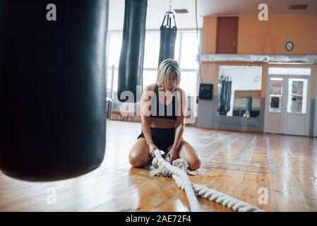 Hobby at weekend times. Tired after workout. Having rest in the gym for box sport training Stock Photo