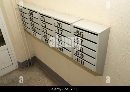 Mailboxes in a residential apartment building. Apartment numbers on mailboxes Stock Photo