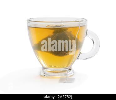 Cup of  green tea with jasmine and pyramid tea bag isolated on white Stock Photo