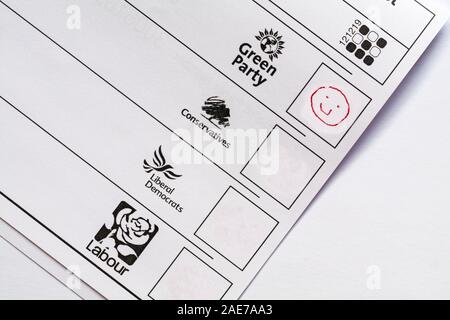 Spoiled spoilt ballot paper for forthcoming Parliamentary Election 2019 in UK - wasted vote smiley face emoji against Green Party Stock Photo