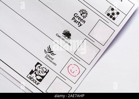 Spoiled spoilt ballot paper for forthcoming Parliamentary Election 2019 in UK - wasted vote smiley face emoji against Liberal Democrats Stock Photo