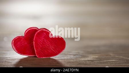 Two hearts on panoramic black wooden background Stock Photo