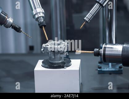 CNC perform drilling from multiple drilling tool Stock Photo