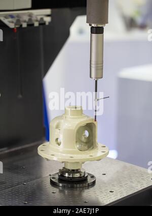 CNC Coordinate Measuring Robotic Machine measuring dimension on workpiece Stock Photo