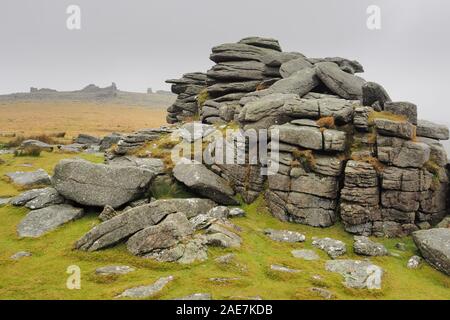 Middle Staple Tor looking up to Great Staple Tor with mist rolling in over the top, Dartmoor National Park, Devon Stock Photo