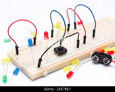 LEDs and cables on prototype table isolated on white background Stock Photo