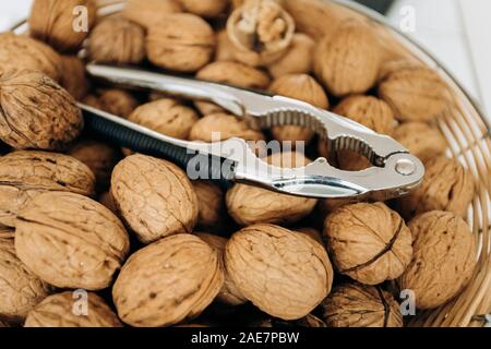 Nutcracker and walnuts in a large bowl Stock Photo