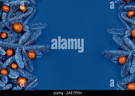 Christmas and New year blue flat lay with orange balls on Christmas tree. Flat lay, top view, copy space. Stock Photo