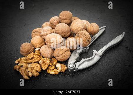 Walnut on over black slate stone background Stock Photo