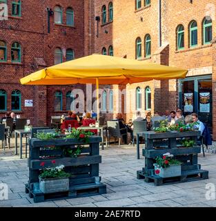 Heritage preservation adaptive reuse of former factory redeveloped as hotel brewery restaurant and concert venue in Wittenberge Brandenburg Germany.
