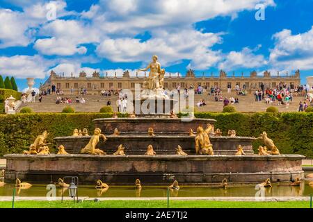 Perfect close-up view of the Latona Fountain (Bassin de Latone) in the Gardens of Versailles with the Palace in the background. On the top tier is a... Stock Photo