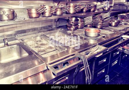 Typical kitchen of a restaurant shot in operation, toned image Stock Photo