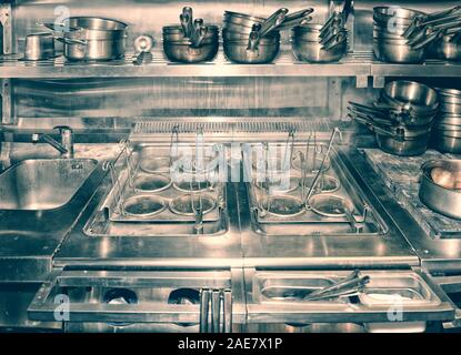 Typical kitchen of a restaurant shot in operation, toned image Stock Photo