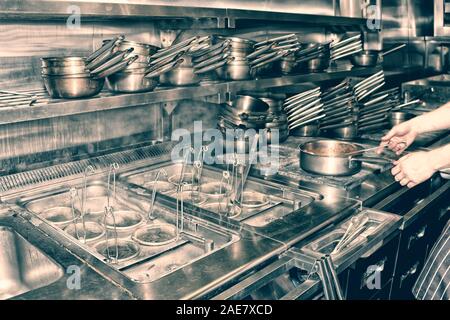 Typical kitchen of a restaurant shot in operation, toned image Stock Photo