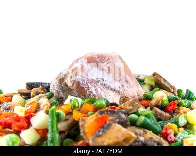 Frozen vegetables and meat on a white background with place for text. Food photo. Vegetable salad. Background image. Free place. Stock Photo