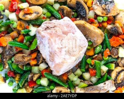 Frozen vegetables and meat on a white background with place for text. Food photo. Vegetable salad. Background image. Free place. Stock Photo