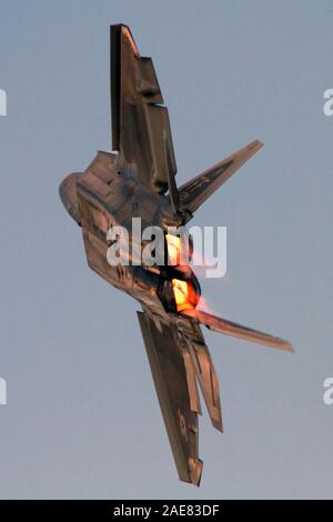 A US Air Force F-22 Raptor turns and burns during a demonstration at Airshow London, Ontario, Canada. Stock Photo