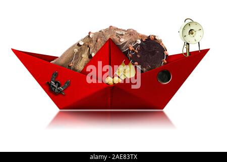 Small red paper fishing boat with fishing nets, buoys with flags, winch and anchor. Isolated on white background Stock Photo