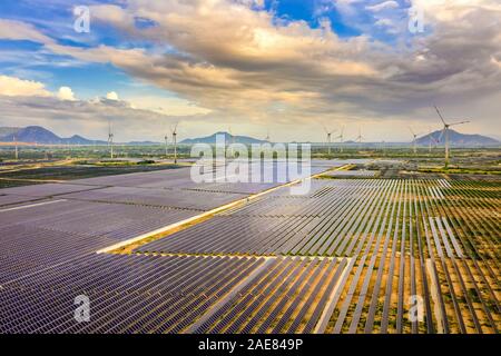 Aerial view of the Solar panel, photovoltaic, alternative electricity source with a wind turbines, Phan Rang, Ninh Thuan, Vietnam Stock Photo