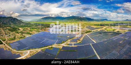 Aerial view of the Solar panel, photovoltaic, alternative electricity source with a wind turbines, Phan Rang, Ninh Thuan, Vietnam Stock Photo