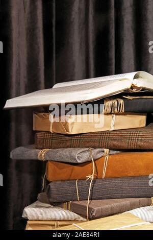 Pile of books packed in recycled wrapping Stock Photo