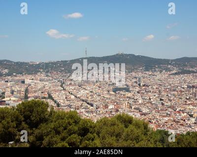 Mountain Ponaramic View with Sagrada Familia Barcelona in Background. Smog is hiding the mountains. Stock Photo