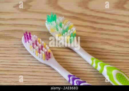 Close-up on new and used toothbrushes Stock Photo