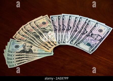 Fan of American (US) money with five, ten & twenty dollar bills featuring US presidents, Abraham Lincoln, Alexander Hamilton & Andrew Jackson Stock Photo