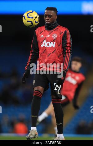 Manchester United's Aaron Wan-Bissaka warms up during the Premier League match at the Etihad Stadium, Manchester. Stock Photo